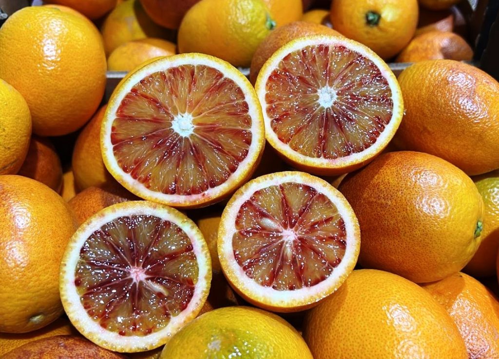 Product features and area of production The Mediterranean areas (the south of Italy and Spain) are perfect for cultivation of Citrus fruit in general, thanks to the temperature variation between summer and winter and between day and night. Sweet oranges grow in a range of different sizes, and shapes varying from spherical to oblong. The grainy irregular rind of the ripe fruit can range from bright orange to yellow-orange and also red-spotted in some varieties. "Oranges" are subdivided into four classes with distinct characteristics: common oranges, blood or pigmented oranges, navel oranges and acidless oranges.   Varieties and availability We commercialize all the indicated classes of oranges so our availability is wide and lasts from October till the beginning of June with our productions both from Italy and Spain. We start with Navelina and blonde orange of Calabria, then begin Tarocco and Moro (historically discovered and cultivated at first in Sicily and Spain). Other mid or late varieties we commercialize are Washington Navel, Lanelate and Valencia and Ovale   Packaging The boxes available are in cardboard, wooden and RPC and the size of packaging and the articles’ calibres are many.